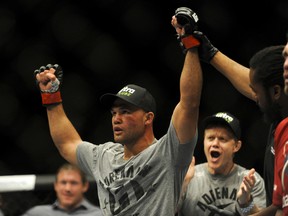 Robbie Lawler (red) celebrates his win against oppenant Jake Ellenberger (not pictured) during their UFC 173 light heavyweight bout at MGM Grand Garden Arena. Lawler won his bout by way of TKO on May 24, 2014 in Las Vegas, NV, USA. (Stephen R. Sylvanie/USA TODAY Sports)