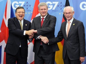 Canada's Prime Minister Stephen Harper is welcomed by European Council President Herman Van Rompuy (R) and European Commission President Jose Manuel Barroso at the European Council headquarters ahead of a G7 meeting in Brussels June 4, 2014. REUTERS/Laurent Dubrule
