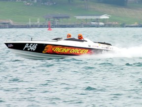 A power boat with a skull on fire painted to its side races down the St. Clair River on Sunday as part of the annual St. Clair River Classic. BRENT BOLES / THE OBSERVER / QMI AGENCY​