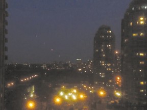 Sarah Chun, of North York, posted videos to YouTube which show a series of unexplained lights hovering over neighbourhoods in the Yonge St.-Sheppard Ave. area on Saturday night. (YOUTUBE)