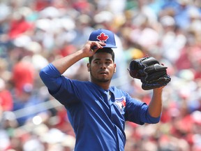 The Blue Jays have designated pitcher Esmil Rogers for assignment in order to make room for Nolan Reimold. (TORONTO SUN/FILES)