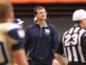 Winnipeg Blue Bombers head coach Mike O'Shea looks up at the screen at a replay during the first half of CFL game against  the BC Lions at BC Place in Vancouver, B.C. on Friday July 25, 2014. (Carmine Marinelli/QMI Agency)