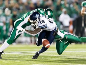 Jarred Fayson of the Argonauts fumbles the ball against the Saskatchewan Roughriders in Regina on Saturday night. (Brent Just/Getty Images/AFP)