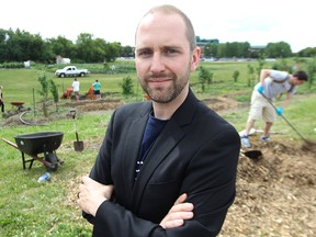 James Magnus-Johnston of Transition Winnipeg is pictured at the Riverview community gardens on Sun., July 27, 2014. Magnus-Johnston believs the city should partner with groups such as Sustainable South Osborne Community Cooperative to move toward a more eco-friendly way of living. (Kevin King/Winnipeg Sun/QMI Agency)