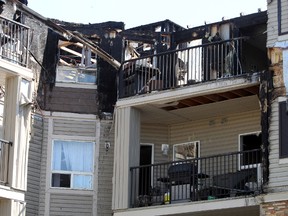Extensive damage is seen from a condo fire in west Edmonton July 21. (PERRY MAH/Edmonton Sun)