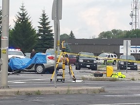Two people are dead and two remain in critical condition after this bizarre, spectacular crash at March and Carling roads in Kanata on Sunday. A car went airborne after hitting the median, then landed on top of another vehicle, witnesses say. (LAURIE-ANN GALVEIAS submitted image)