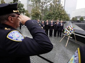 First Responders are honoured during a wreath-laying ceremony to mark the 10th anniversary of the 9/11 attacks on the World Trade Center, in New York on September 20, 2011. Pictured are Mayor Michael Bloomberg (background L), Port Authority Police Department Superintendent Michael Fedorko (2nd L), New York Police Department Commissioner Raymond Kelly (C) and Fire Department of New York Commissioner Salvatore Cassano (R). (REUTERS/Chip East)