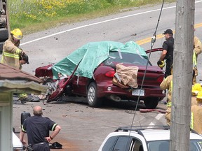 Two people killed Friday when their sedan collided with a dump truck have been identified.