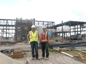 Jason Kopan, project manager with ISL Engineering and Land Services and Greg Germain, project co-ordinator with Nason Contracting Group stand in front of the skeleton of the new Drayton Valley Water Treatment Plant. The building is expected to be closed in in the coming weeks and is on track to start operation next June.