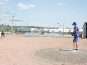 10-year-old Jaxon Zanolli practices with his dad and coach Josh Zanolli at the baseball diamonds. The Drayton Valley AA Mosquito Giants team currently stand in second place going into the provincial championship, which will be held in Drayton Valley on the August long weekend. Coach Josh Zanolli wants the players to work hard and have fun at the games.