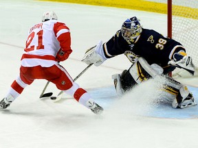 Apr 13, 2014; St. Louis, MO, USA; St. Louis Blues goalie Ryan Miller (39) makes a save on Detroit Red Wings left wing Tomas Tatar (21). Jasen Vinlove-USA TODAY Sports
