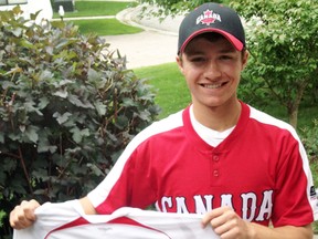 Tyler Pauli shows off his autographed Team Canada jersey from the 2014 ISF Junior Men’s World Softball Championship in Whitehorse July 11-20. Pauli had his teammates sign a game ball as well as the jersey as keepsakes from the tournament. ANDY BADER/MITCHELL ADVOCATE