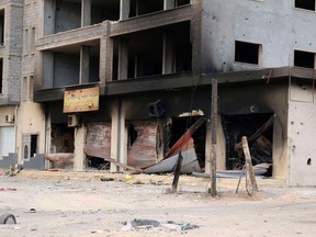 A damaged building is pictured after clashes between rival militias, in an area at Alswani road in Tripoli July 28, 2014. (REUTERS/Hani Amara)