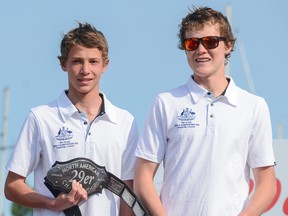 Kurt Hansen, left, and Harry Morton stand on the podium as they are crowned 29er class North American champions Thursday at Portsmouth Olympic Harbour. (Alex Pickering/For The Whig-Standard)