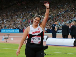 Sultana Frizell celebrates winning the gold medal in the women's hammer throw final at the Commonwealth Games in Glasgow, Scotland, Monday, July 28, 2014. (Suzanne Plunkett/Reuters)
