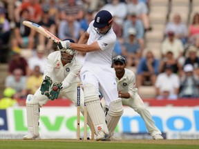 England’s Alastair Cook (centre) is caught out by India’s Mahendra Singh Dhoni (left) for 95 runs on Monday during the third Test at the Rose Bowl cricket ground in Southampton, England. (Philip Brown/Reuters)