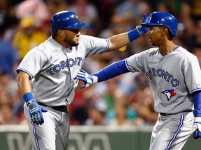 Blue Jays left fielder Melky Cabrera (left) celebrates his home run against the Red Sox with centrefielder Anthony Gose (right) during the sixth inning in Boston on Monday, July 28, 2014. (Mark L. Baer/USA TODAY Sports)