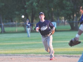Jamie Kirkland of the Portage Padres throws to first during the Padres' 9-3 Game 3 semifinal loss to Carberry July 28. (Kevin Hirschfield/The Graphic/QMI AGENCY)