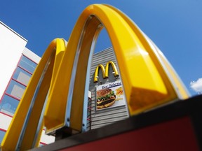A logo of McDonald's is on display outside its restaurant on the outskirts of Moscow July 25, 2014. (REUTERS/Maxim Shemetov)