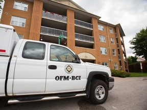 The Office of the Fire Marshal vehicle in front of an apartment building at 735 Stonehaven Ave in Newmarket on Monday, July 28, 2014. A woman was taken to hospital after a fire in her apartment. (Ernest Doroszuk/Toronto Sun)