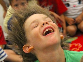 Alex Plumb, 8, gets a gust of air from a leaf blower during a Mad Science of London presentation at the Komoka library July 24. ELENA MAYSTRUK/AGE DISPATCH/QMI AGENCY