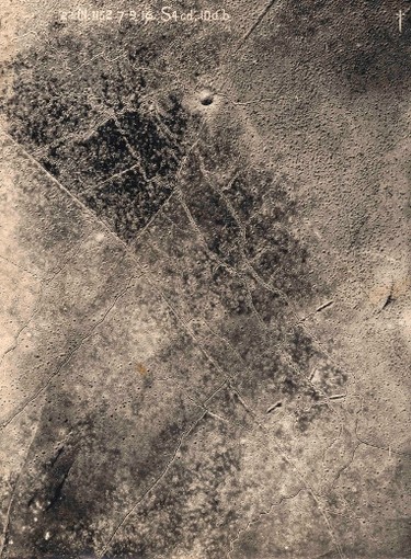 An aerial photograph taken from a British aeroplane shows a view of trenches with a giant crater and shell damage marking the land between the trenches on the Western Front, in this September 7, 1916 handout picture. This picture is part of a previously unpublished set of World War One (WWI) images from a private collection. The pictures offer an unusual view of varied and contrasting aspects of the conflict, from high tech artillery to mobile pigeon lofts, and from officers partying in their headquarters to the grim reality of life and death in the trenches. The year 2014 marks the centenary of the start of the war.  REUTERS/Archive of Modern Conflict London/Handout via Reuters (FRANCE - Tags: SOCIETY ANNIVERSARY POLITICS CONFLICT MILITARY)

ATTENTION EDITORS - PICTURE 37 OF 40 FOR PACKAGE 'WWI - GUNS, GAS MASKS AND PIGEONS'
TO FIND ALL IMAGES SEARCH "GAS MASKS AND PIGEONS'

ATTENTION EDITORS - NO SALES. NO ARCHIVES. THIS PICTURE WAS PROVIDED BY A THIRD PARTY. IT IS DISTRIBUTED, EXACTLY AS RECEIVED BY REUTERS, AS A SERVICE TO CLIENTS. REUTERS IS UNABLE TO INDEPENDENTLY VERIFY THE AUTHENTICITY, CONTENT, LOCATION OR DATE OF THIS IMAGE. FOR EDITORIAL USE ONLY. NOT FOR SALE FOR MARKETING OR ADVERTISING CAMPAIGNS
