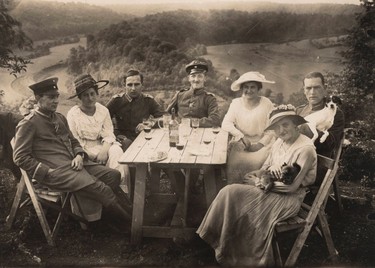 German Air Force Officers and friends have a picnic in this 1918 handout picture. This picture is part of a previously unpublished set of World War One (WWI) images from a private collection. The pictures offer an unusual view of varied and contrasting aspects of the conflict, from high tech artillery to mobile pigeon lofts, and from officers partying in their headquarters to the grim reality of life and death in the trenches. The year 2014 marks the centenary of the start of the war.  REUTERS/Archive of Modern Conflict London/Handout via Reuters