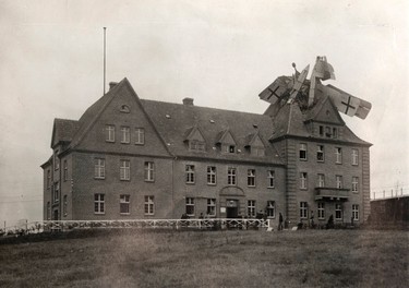 A German Friedrichshafen seaplane is seen crashed into a building in Germany, 1918 in this handout picture. This picture is part of a previously unpublished set of World War One (WWI) images from a private collection. The pictures offer an unusual view of varied and contrasting aspects of the conflict, from high tech artillery to mobile pigeon lofts, and from officers partying in their headquarters to the grim reality of life and death in the trenches. The year 2014 marks the centenary of the start of the war.  REUTERS/Archive of Modern Conflict London/Handout via Reuters
