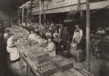A view of women working at the Brewery Road Works munitions factory in this 1916 handout picture. This picture is part of a previously unpublished set of World War One (WWI) images from a private collection. The pictures offer an unusual view of varied and contrasting aspects of the conflict, from high tech artillery to mobile pigeon lofts, and from officers partying in their headquarters to the grim reality of life and death in the trenches. The year 2014 marks the centenary of the start of the war.  REUTERS/Archive of Modern Conflict London/Handout via Reuters