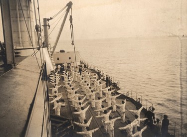 Sailors take part in morning exercises aboard a German Navy warship in this 1917 handout picture taken at an unknown location at sea. This picture is part of a previously unpublished set of World War One (WWI) images from a private collection. The pictures offer an unusual view of varied and contrasting aspects of the conflict, from high tech artillery to mobile pigeon lofts, and from officers partying in their headquarters to the grim reality of life and death in the trenches. The year 2014 marks the centenary of the start of the war.  REUTERS/Archive of Modern Conflict London/Handout via Reuters