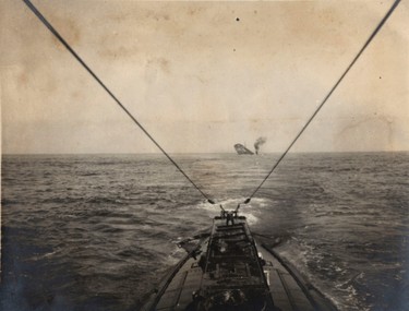 A German U-boat sinks an Allied merchant vessel in the Atlantic Ocean in this 1915 handout picture. This picture is part of a previously unpublished set of World War One (WWI) images from a private collection. The pictures offer an unusual view of varied and contrasting aspects of the conflict, from high tech artillery to mobile pigeon lofts, and from officers partying in their headquarters to the grim reality of life and death in the trenches. The year 2014 marks the centenary of the start of the war.  REUTERS/Archive of Modern Conflict London/Handout via Reuters