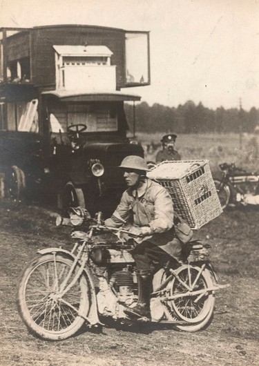 A British soldier rides a motorbike with a basket of pigeons on his back, on his way to delivering them to the frontline on the Western Front in this c1916 handout picture. This picture is part of a previously unpublished set of World War One (WWI) images from a private collection. The pictures offer an unusual view of varied and contrasting aspects of the conflict, from high tech artillery to mobile pigeon lofts, and from officers partying in their headquarters to the grim reality of life and death in the trenches. The year 2014 marks the centenary of the start of the war.  REUTERS/Archive of Modern Conflict London/Handout via Reuters