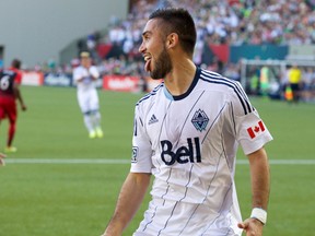 Vancouver Whitecaps midfielder Pedro Morales reacts after making a penalty kick for a goal against Portland Timbers goalkeeper Donovan Ricketts at Providence Park on June 1, 2014. (Jaime Valdez/USA TODAY Sports)