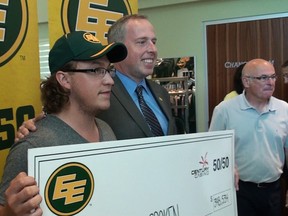 Connor Croken collects his 50/50 cheque from the Edmonton Eskimos, July 29, 2014. (EDMONTON SUN)