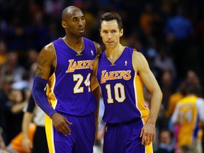 Los Angeles Lakers shooting guard Kobe Bryant (24) and point guard Steve Nash of Canada (10) after shaking hands after beating the Charlotte Bobcats during the second half of their NBA basketball game in Charlotte, North Carolina February 8, 2013. (REUTERS)