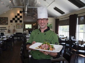 Chef Andrew Wolowicz shows off The Springs Seared Eversprings Farms Duck Breast with Gnoochi and Chantrelle Mushrooms. (DEREK RUTTAN, The London Free Press)