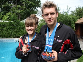 Sister-brother swimming duo Maude, 13, and Samuel Boily-Dufour, 15, show off their medals from the Canadian Age Group Swimming Championships earlier this month. Both of the Sarnia Rapids "Y" Swim Team competitors swam away with multiple podium finishes.TYLER KULA/ THE OBSERVER/ QMI AGENCY