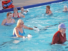 Lynn Johnson, bottom right, leads a group of about 15 swimmers through some aquasize exercises on the evening of July 28 at the Vulcan Swimming Pool. The group meets every Monday and Wednesday evening from 8-9 p.m.
Photo by Simon Ducatel Vulcan Advocate