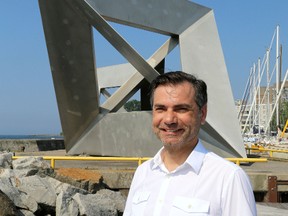 Colin Wiginton, the city of Kingston acting cultural director in front of Tetra, by artist Ted Bieler at the Portsmouth Olympic Harbour  in Kingston on Tuesday July 22 2014.  IAN MACALPINE/KINGSTON WHIG-STANDARD/QMI AGENCY