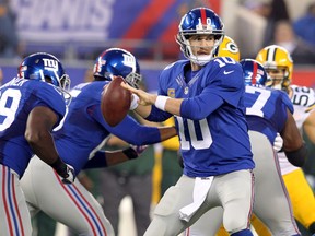 New quarterback coach Danny Langsdorf has told Eli Manning he expects him to complete 70% of his passes this season. (Brad Penner-USA TODAY Sports)