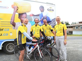 JOHN LAPPA/THE SUDBURY STAR/QMI AGENCYTimo Itkonen, left, Mike Woodard, Richard Blaschek and Robert Montgomery are cycling across Canada in 60 days to raise money for wells in Africa. The men, who are in their 60s,  are at the midway point of their trek on behalf of the Global Aid Network in an effort of creating 60 wells in four locations in Africa. The cyclists stopped in Sudbury on Tuesday, July 29, 2014 for a reception.