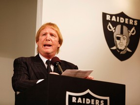 Raiders' owner Mark Davis introduces new head coach Dennis Allen (not pictured) during a news conference at the Raiders' training facility in Oakland, California January 30, 2012. (REUTERS)