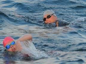 Annaleise Carr keeps ahead of pacer Josh Reid during her swim across Lake Erie in September, 2014.   SARAH DOKTOR/ Simcoe Reformer