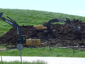 Backhoes work on the Waste Management Landfill outside of Petrolia. (QMI Agency file photo)