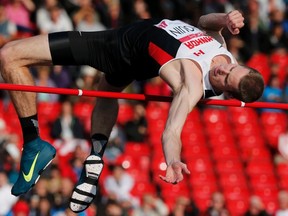 Corunna's Derek Drouin captured the Men's High Jump gold medal at the 2014 Commonwealth Games in Glasgow, Scotland, on Wednesday, July 30. Drouin jumped 2.31m to claim his 2nd international crown after winning the 2013 Francophone Games last year.  REUTERS/Suzanne Plunkett