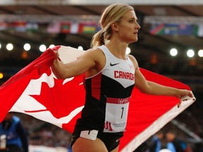 Brianne Theisen-Eaton of Canada reacts after winning gold in the heptathlon at the 2014 Commonwealth Games in Glasgow, Scotland, July 30, 2014. (REUTERS/Phil Noble)