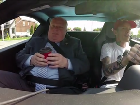 Mayor Rob Ford goes for a coffee run with Deadmau5 in the DJ's 2013 Ferrari 458 Spider (F1 edition) on Wednesday, July 30, 2014. (YouTube framegrab)