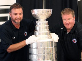 Howie Borrow, left, and Mike Bolt are two of the four keepers of the Stanley Cup and both were the trophy's guardians Sunday July 27, 2014 when Woodstonian Jake Muzzin had his day with the NHL's top prize. The two of them have a gruelling schedule throughout the summer to ensure every member of the Los Angeles Kings organization gets their moment with the Stanley Cup.

GREG COLGAN/QMI Agency/Sentinel-Review