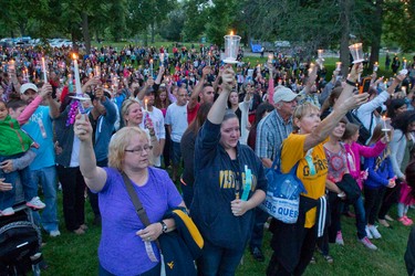 Over a thousand people stand in silence at a candle lit vigil for six-year-old Addison Hall in Greenway Park in London on Wednesday July 30, 2014.  Addison Hall was killed last Friday while walking in a south London Costco store with her mother when the family was struck by a car.
CRAIG GLOVER The London Free Press / QMI AGENCY