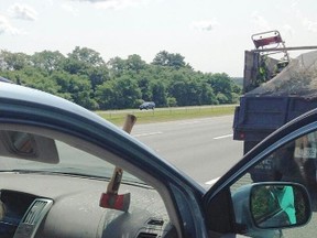 An axe flew off a truck in Massachusetts and went through the windshield of a car travelling behind.
(Photo from Massachusetts State Police)